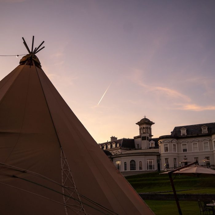 A Tipi sits in front of the K club, County Kildare at sunset
