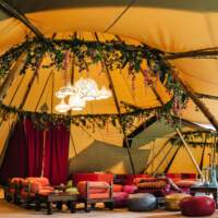 Arabian style Tipi party with low furniture, rugs and plants by Blue Moon Event Design