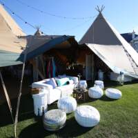 Arabian themed furniture decorate the open sides of the Tipis, at the Dubai Duty Free Corporate Event