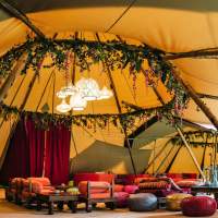 Arabian style Tipi party with low furniture, rugs and plants by Blue Moon Event Design