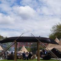 Odaios Tipi Food Fair is underway, 13 Tipis line up either side and an old decorative rowboat & oars sit in the middle